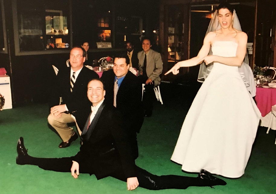 This has to be the only photo of its kind in the world—doing splits on your wedding day! Priceless! Janice is a beautiful bride!