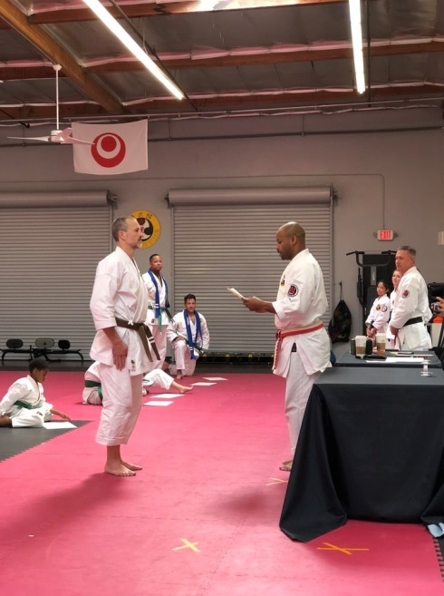 Growler receiving his shodan ranking in Okinawan Shorin Ryu Karate.