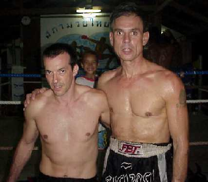 In the ring with one of his fellow fighters.